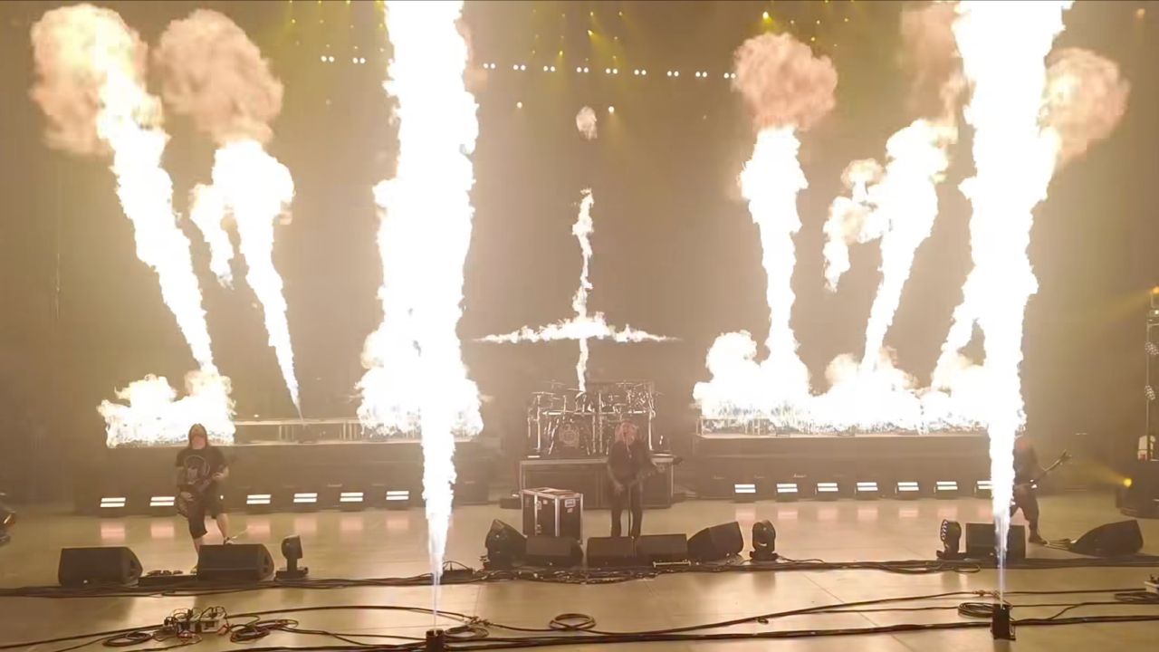 Slayer performing on a stage with lots and lots of fire