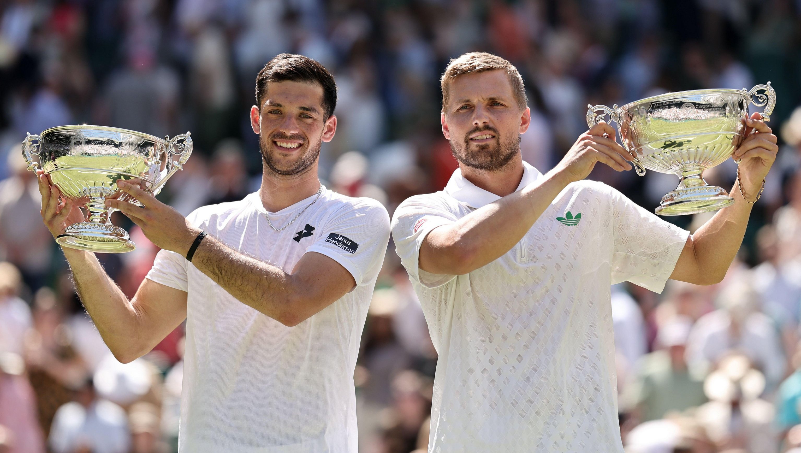 Wimbledon, UK. 12th July, 2025. Julian Cash (GBR) and Lloyd Glasspool (GBR) Gentlemen's doubles final at the trophy presentation during Wimbledon 2025. Credit: corleve/Alamy Live News