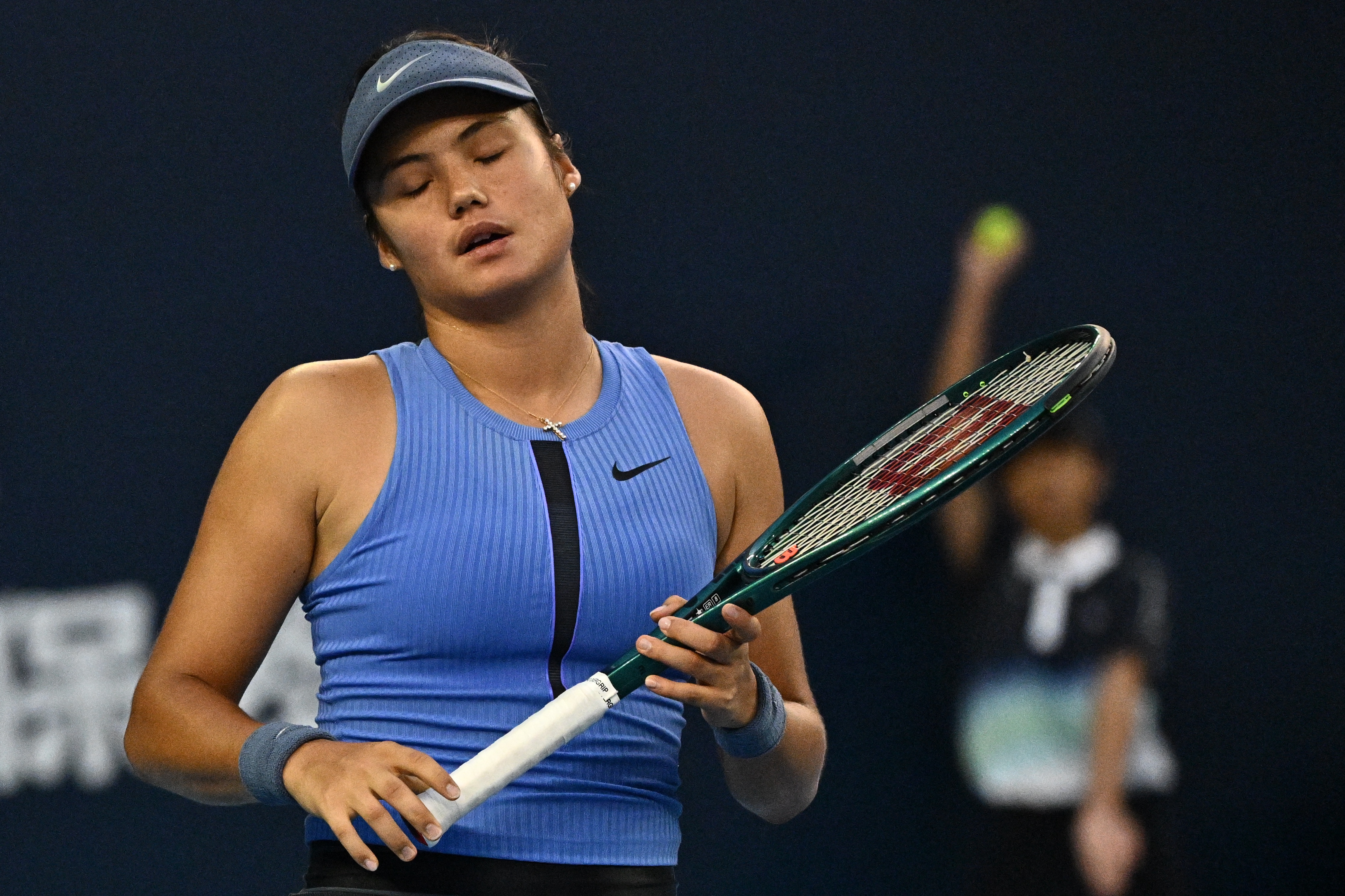 Emma Raducanu reacts during her women's singles match at the China Open.
