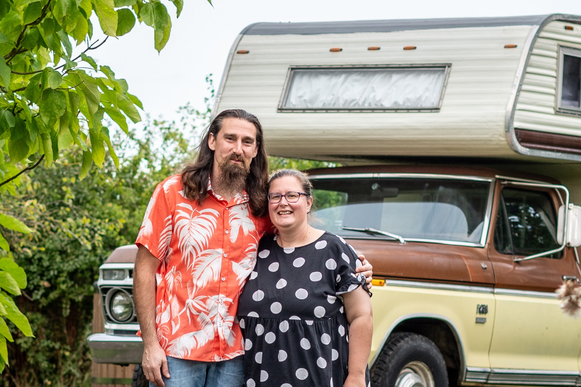 Alex and Louise LEISERACH standing in front of a vintage motorhome.