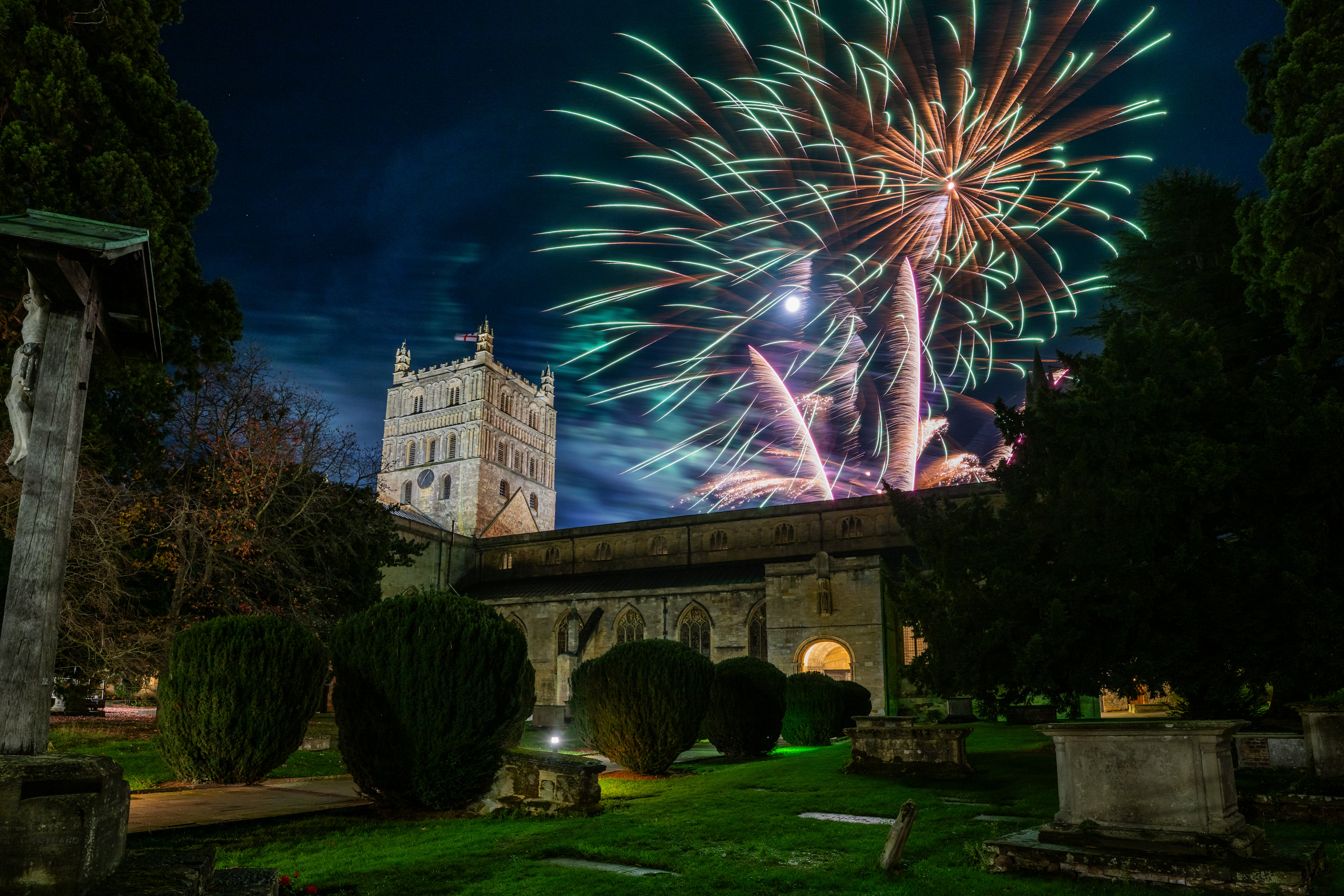 Fireworks exploding over the Tewkesbury Abbey.