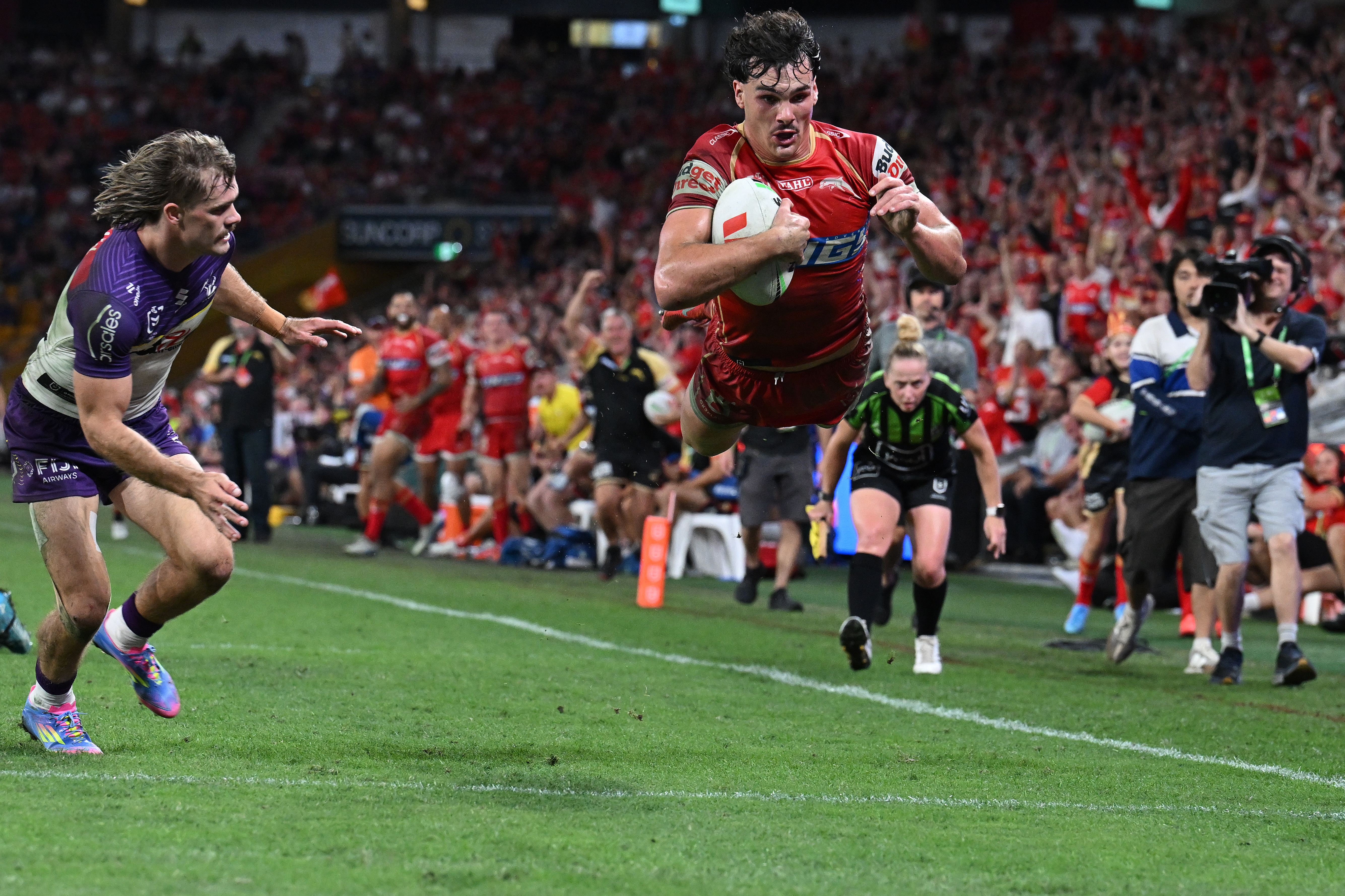 Herbie Farnworth of the Dolphins scoring a try during the NRL match against Melbourne Storm.