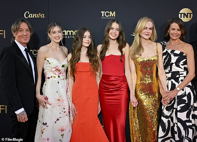 Nicole spent this Thanksgiving without her youngest daughters after the superstar agreed to allow Sunday Rose, 17, and Faith Margaret, 14 -  seen second and third left - to spend Turkey Day with their dear old dad