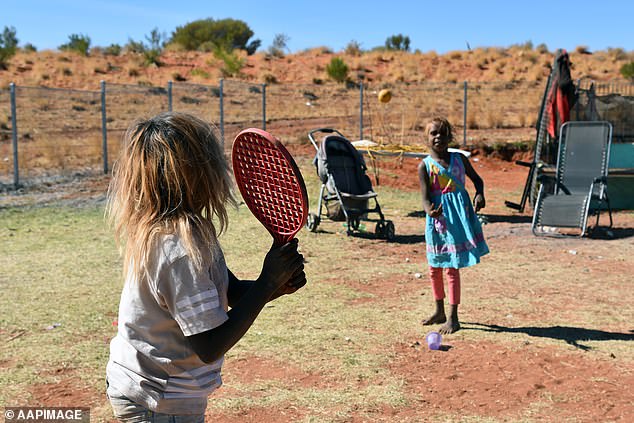Two young girls play in Titjikala, an Aboriginal community 120km south of Alice Springs. In stark contrast, people living in Greater Darwin and remote regions in the Northern Territory can expect to live just 74.3 years