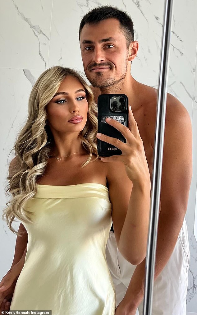 Tomic, 33, retired after just one point in the second set of his round of 32 match on Tuesday against Japanese wildcard Hayato Matsuoka (the Aussie tennis star is pictured, with girlfriend Keely Hannah)