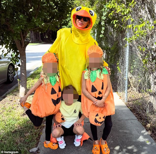 Kournikova pictured with her children during Halloween near their home in Miami