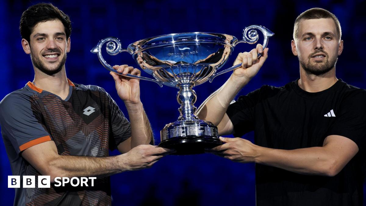 Julian Cash and Lloyd Glasspool lift the trophy for finishing as the leading ATP Tour doubles pair in 2025