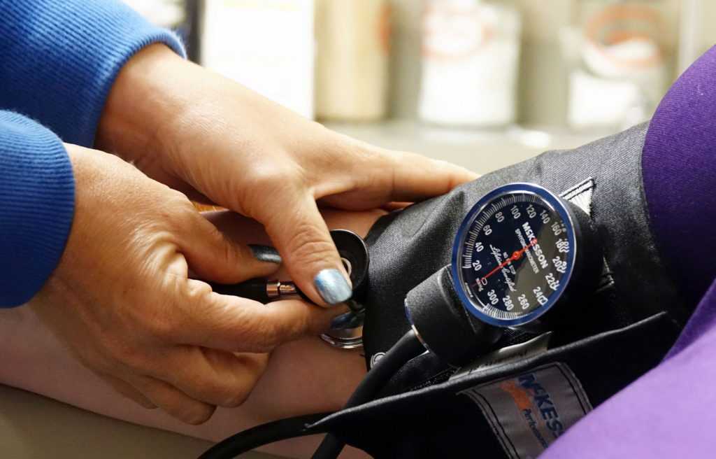 A nurse takes someones blood pressure inside of the East Arkansas Family Health Center in Lepanto