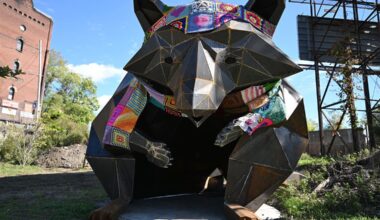 A 12-foot tall raccoon sculpture draws people of all ages to a new park in Millvale