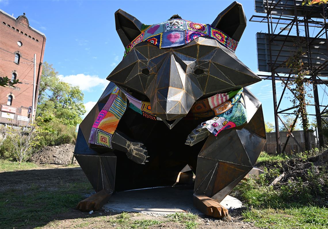 A 12-foot tall raccoon sculpture draws people of all ages to a new park in Millvale