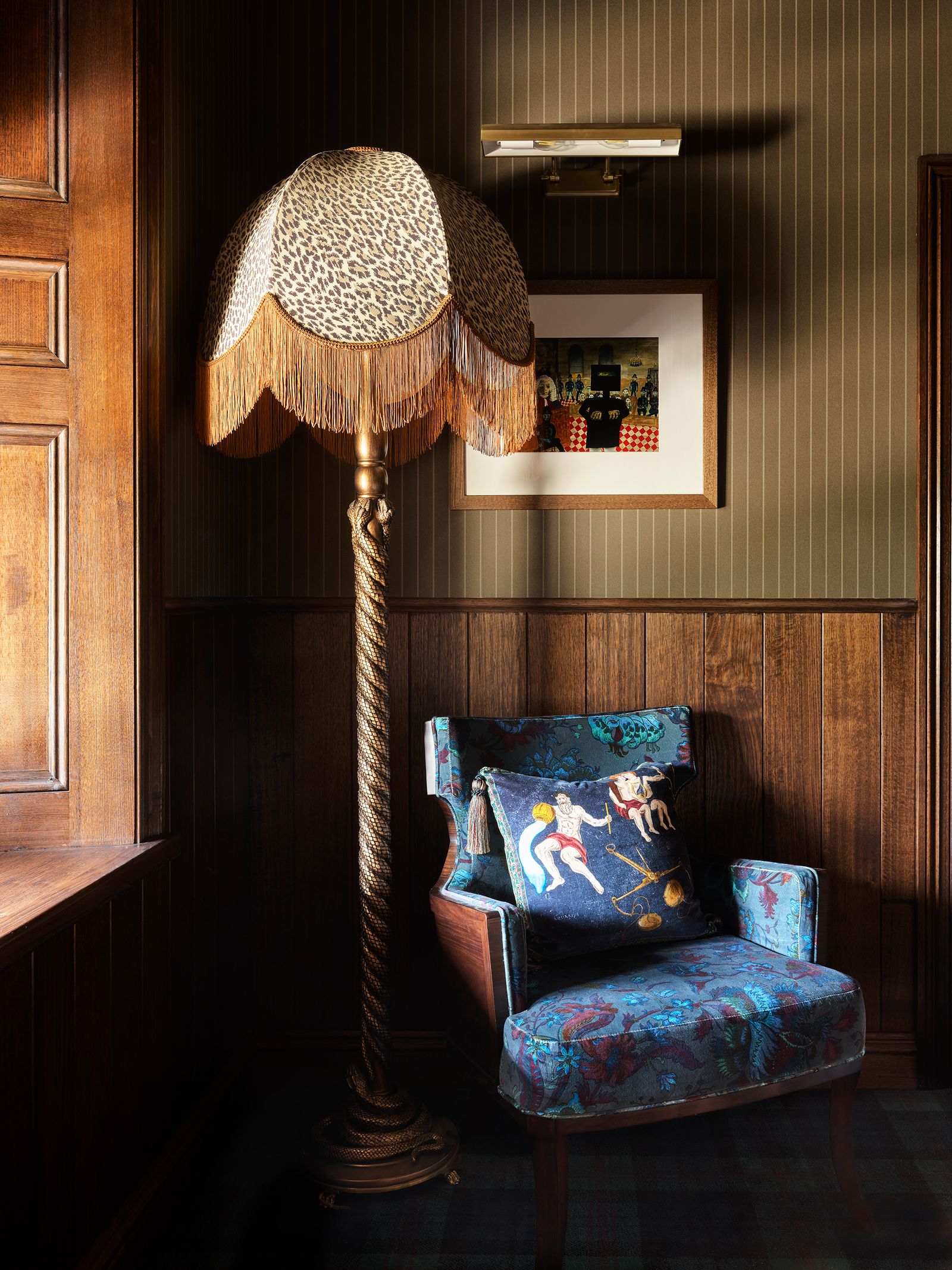 Image may contain Lamp Chair Furniture Floor Lamp Person Indoors and Interior Design