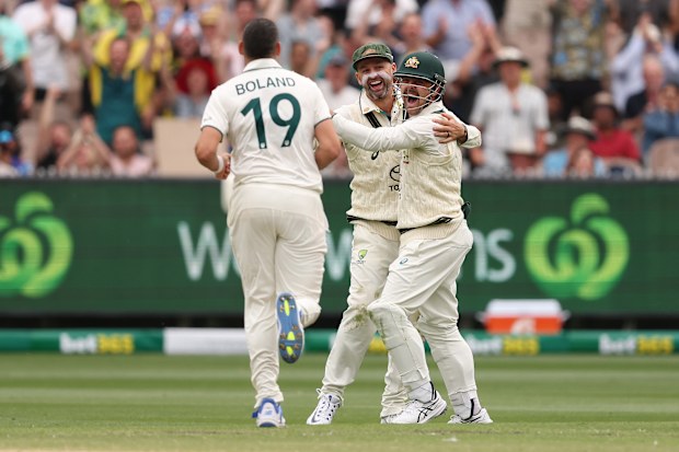 MELBOURNE, AUSTRALIA - DECEMBER 27: Scott Boland, Nathan Lyon and Travis Head of Australia celebrate the wicket of Akash Deep of India during day two of the Men's Fourth Test Match in the series between Australia and India at Melbourne Cricket Ground on December 27, 2024 in Melbourne, Australia. (Photo by Morgan Hancock - CA/Cricket Australia via Getty Images)