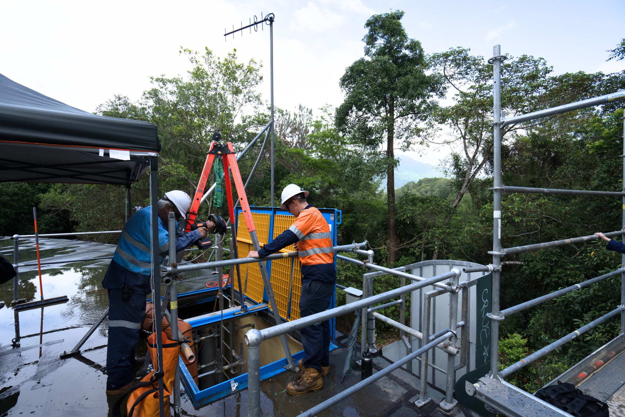 Council staff and contractors repairing one of the city’s vital reservoirs. Picture: Cairns Regional Council.
