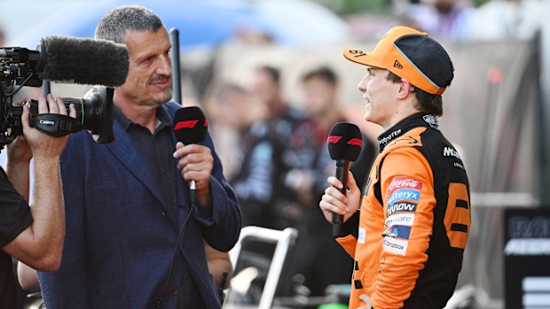 Oscar Piastri is interviewed by Guenther Steiner in Parc Ferme during the F1 Grand Prix.