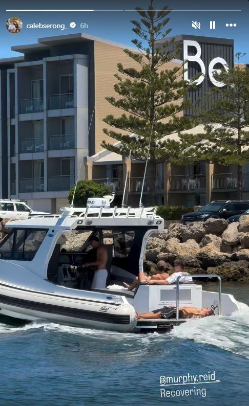 Murphy Reid on the back of a boat.