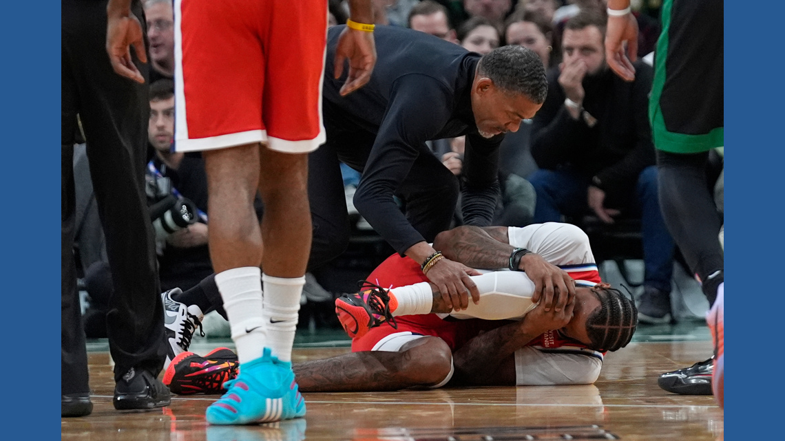 Clippers F Derrick Jones Jr. helped to locker room with apparent knee injury following a collision