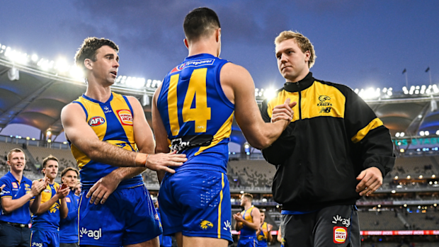 West Coast's Oscar Allen with Liam Duggan and Jamie Cripps.