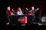 Live Wire's Luke Burbank and Elena Passarello interview actor and filmmaker Bruce Campbell during the variety show's 20th year, at Revolution Hall in Portland, Oregon, on Dec. 24, 2024.