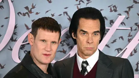 Getty Images British actor Matt Smith (L) and Australian musician and author Nick Cave (R) pose on the red carpet upon arrival to attend the world premiere of TV series The Death of Bunny Munro, based on a novel by Nick Cave of the same name, at the Royal Festival Hall in London on October 30, 2025.