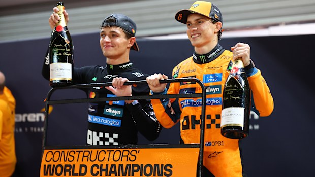 Lando Norris and Oscar Piastri celebrate McLaren winning the constructors' championship.