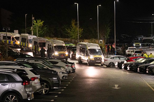 Emergency vehicles line up at the scene.