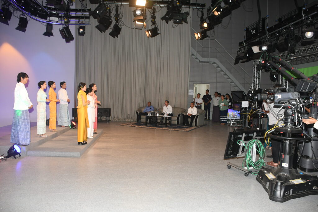 The filming processes for awareness songs to promote a successful multiparty democracy general election in progress at MRTV in Yangon yesterday, watched by Union Minister U Maung Maung Ohn.