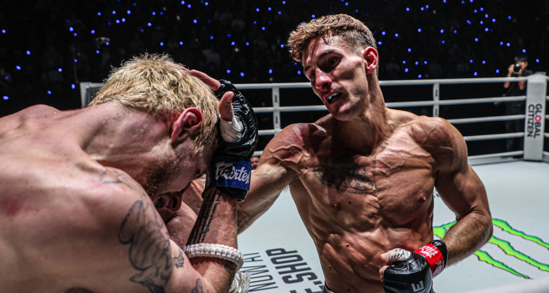 Muay Thai fighter Nico Carrillo punches Luke Lessei in the corner