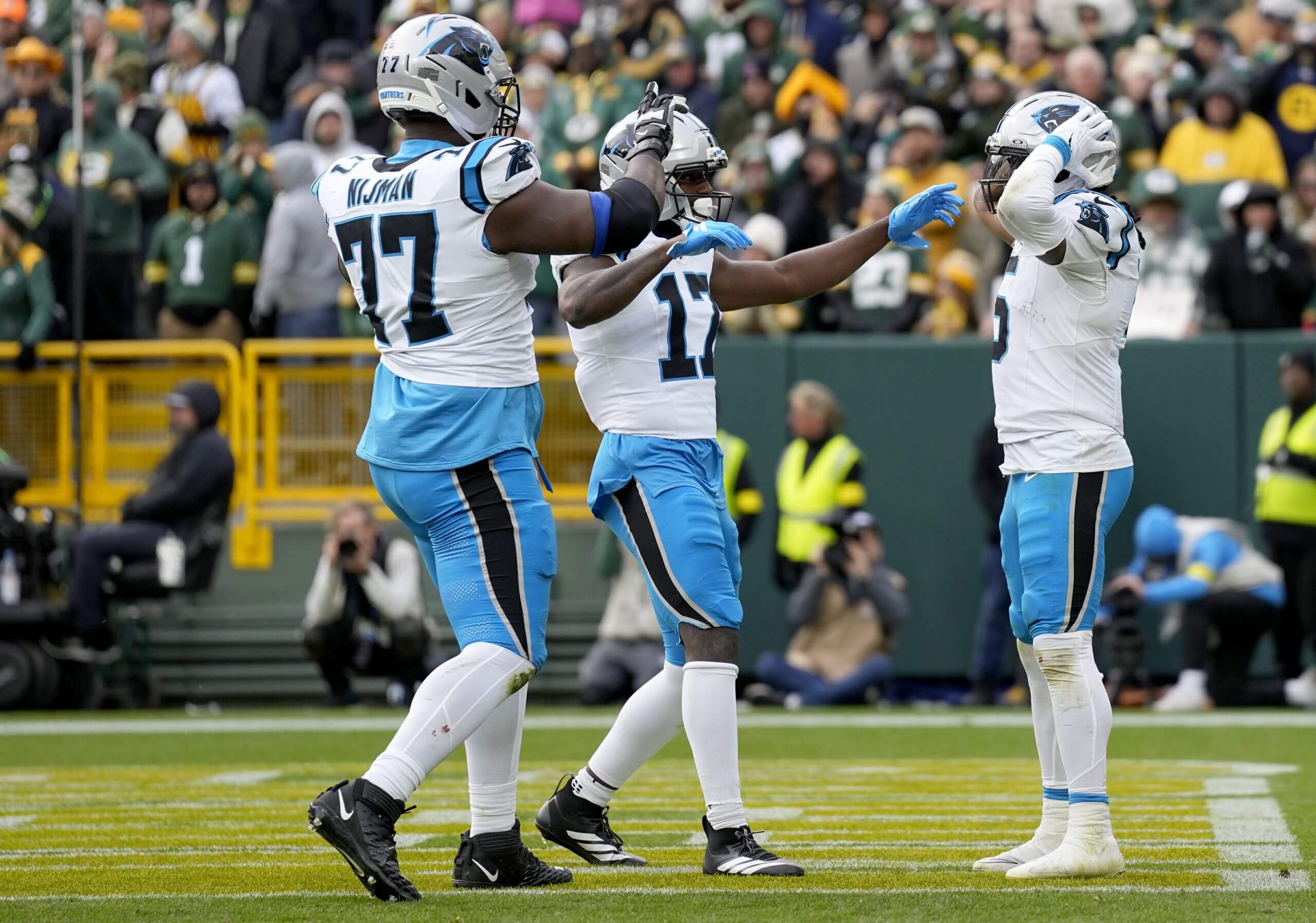 Carolina Panthers running back Rico Dowdle celebrates with teammates after scoring against the Packers.