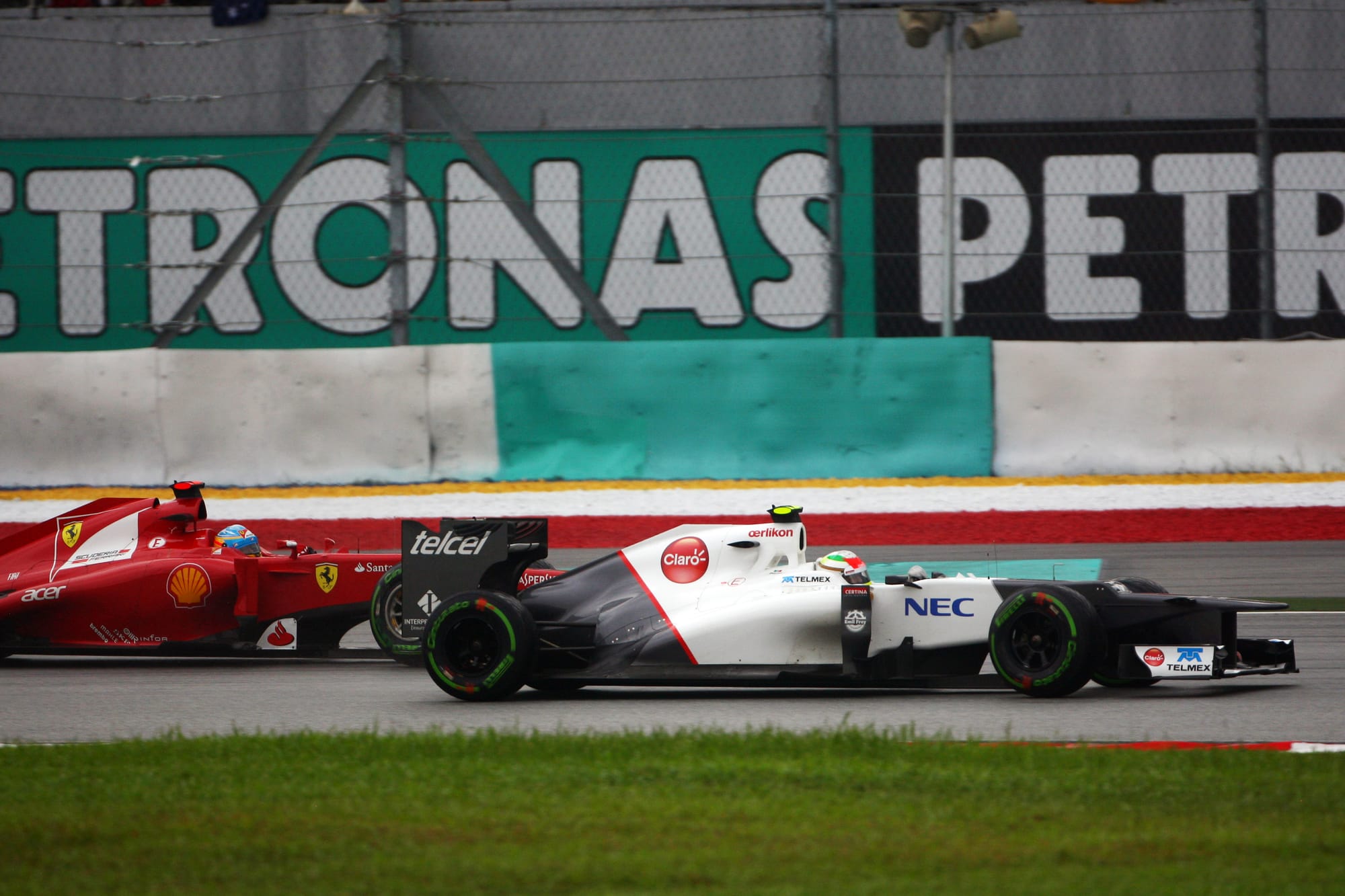 Sergio Perez leads Fernando Alonso in the 2012 Malaysian Grand Prix