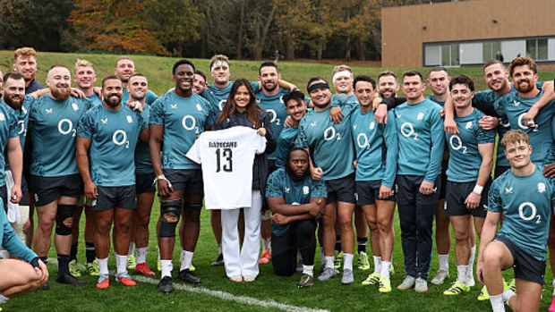 British tennis player Emma Raducanu is presented with an England rugby jersey.