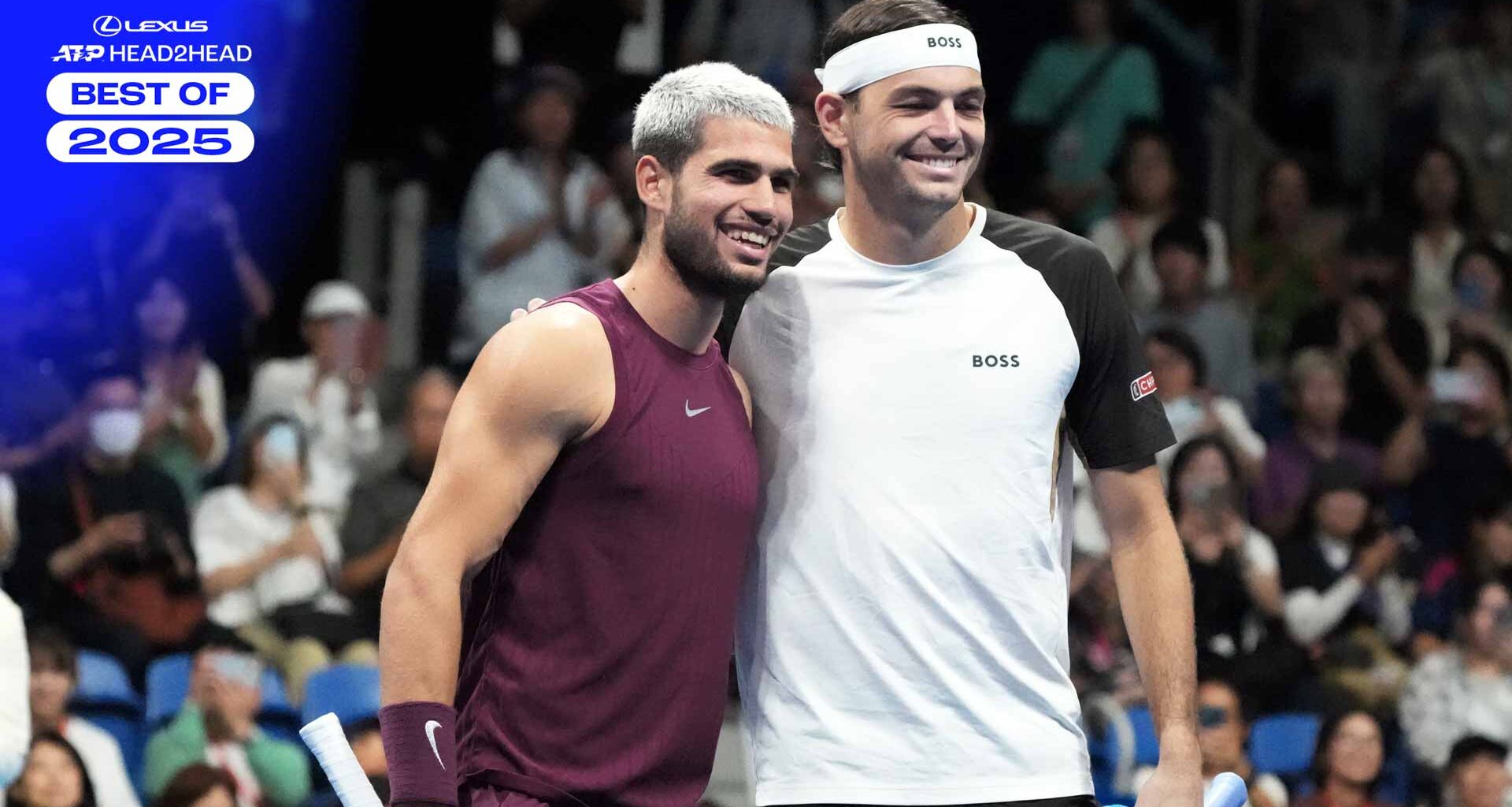 Carlos Alcaraz and Taylor Fritz pose for pictures before the championship match in Tokyo.
