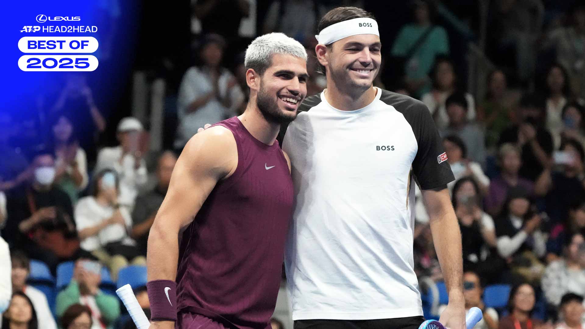 Carlos Alcaraz and Taylor Fritz pose for pictures before the championship match in Tokyo.