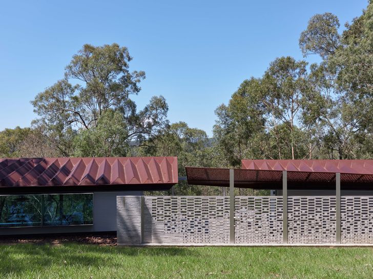 Two concertina Corten roofs, seen from above on arrival, provide ember-resistant shelter.