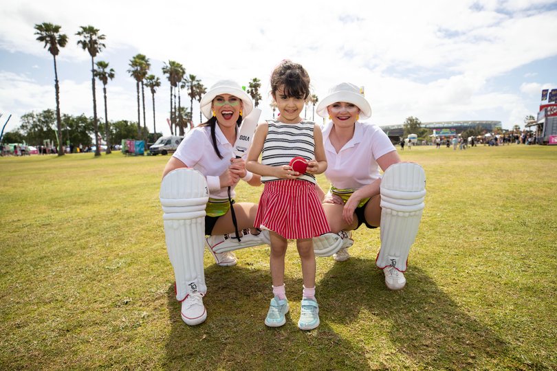 Neela Khayatan, 4, is pictured with the Cricketers from Fliptease. 
