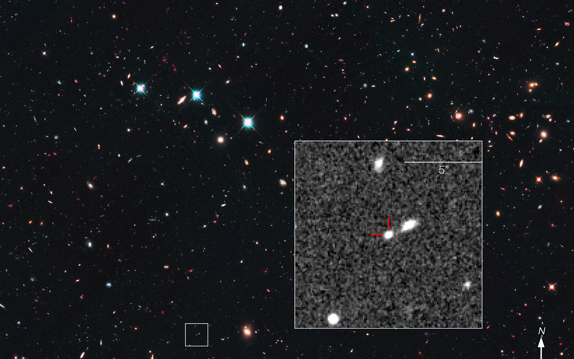 a blob of white light on a grainy, grey background, superimposed on a star-filled view of deep space filled with colorful galaxy swirls