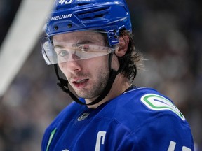 Vancouver Canucks captain Quinn Hughes waits for a faceoff during the first period against the Colorado Avalanche at Rogers Arena on Sunday night