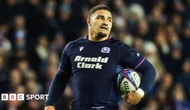 Sione Tuipulotu talks to teammates after defeat by Argentina