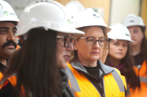 Premier Jacinta Allan, centre, at a building site for the Suburban Rail Loop.