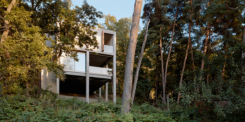concrete columns lift residence above forested terrain in georgia