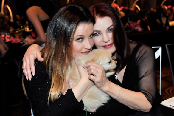 The late Lisa Marie Presley (left) and Priscilla in Las Vegas in 2011.