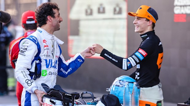 Daniel Ricciardo of Australia and Visa Cash App RB congratulates race winner Oscar Piastri of Australia and McLaren during the F1 Grand Prix of Azerbaijan at Baku City Circuit on September 15, 2024 in Baku, Azerbaijan. (Photo by Kym Illman/Getty Images)