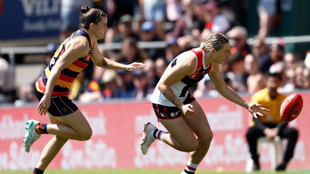 Darcy Guttridge of the Saints and Chelsea Randall of the Crows.