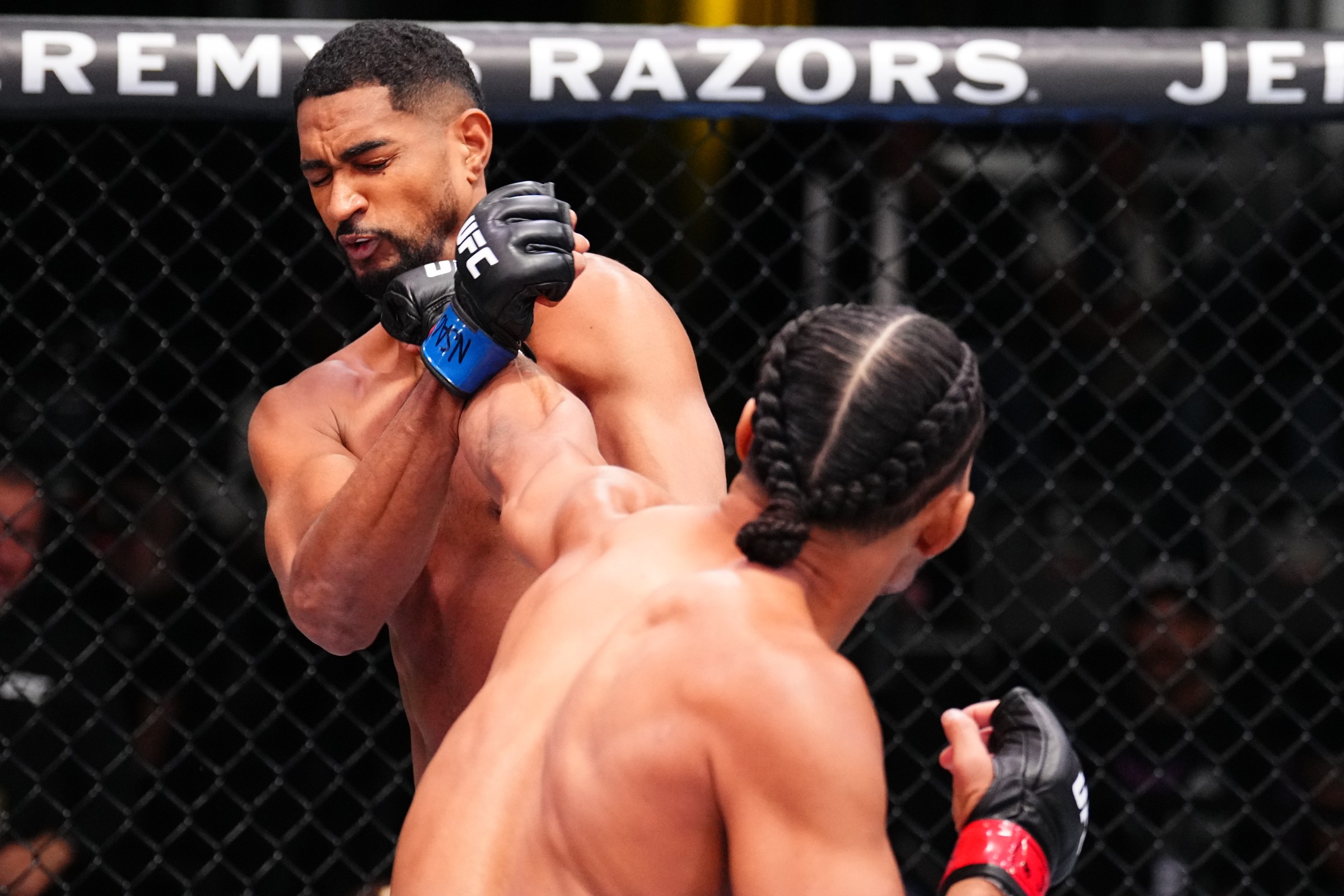 LAS VEGAS, NEVADA - NOVEMBER 01: (R-L) Billy Elekana punches Kevin Christian of Brazil in a light heavyweight fight during the UFC Fight Night event at UFC APEX on November 01, 2025 in Las Vegas, Nevada. (Photo by Chris Unger/Zuffa LLC)