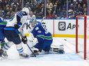 Winnipeg Jets' Jonathan Toews (19) redirects the puck past Vancouver Canucks goalie Thatcher Demko to score during the first period at Rogers Arena on Tuesday night.