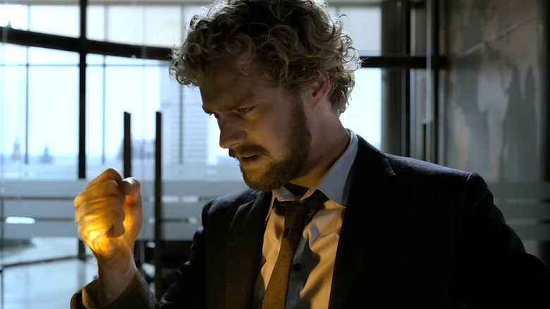 Finn Jones' Danny Rand looking at his glowing fist on Iron Fist