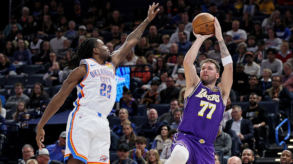 Luka Doncic shoots over Cason Wallace