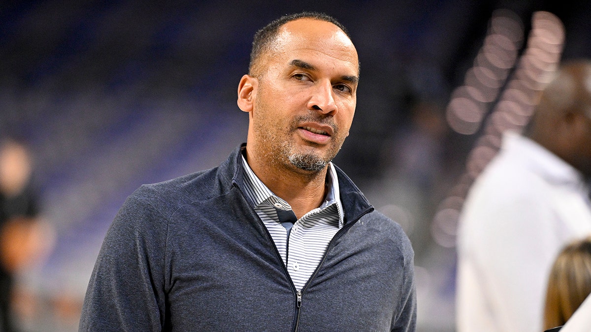 Nico Harrison looks on