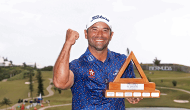 Rafael Campos punches the air while holding the Butterfield Bermuda Championship trophy in 2024
