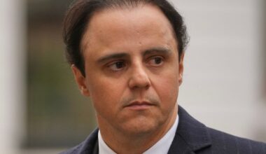Former Ferrari Formula  driver Felipe Massa leaves the Royal Courts of Justice in London (AP Photo/Kin Cheung)
