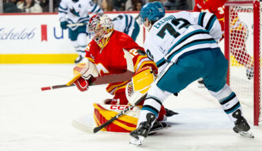 Wolf makes 16 saves, Flames stifle Sharks in shutout